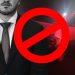 Man in a Suit in the Foreground with a Crashed White Van Behind; a Red Prohibition Symbol Overlays the Image, Signaling 'not Allowed'. - Regios Al Cuadrado